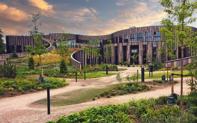 Large building with a pitched green roof